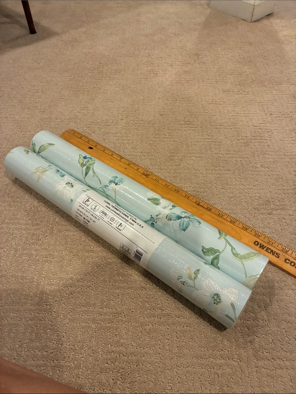 Two unopened rolls Floral Vine Wallpaper in Light Blue and White